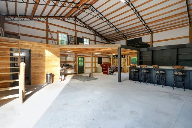 a room with furniture and a flat screen tv