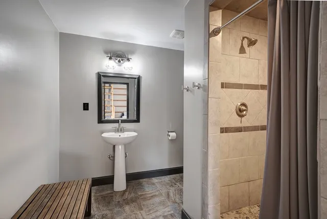 a white toilet sitting next to a bathroom sink