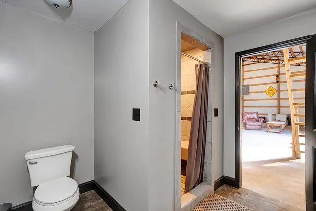 a view of a garage with wooden floor