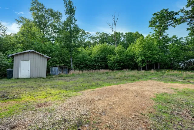 a view of a backyard of the house