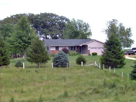 19962 Coleta Road Sterling, IL 61081 - Photo 1 of 6 a view of a house with a yard and sitting area