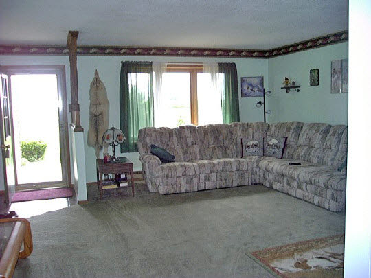 19962 Coleta Road Sterling, IL 61081 - Photo 6 of 6 a living room with furniture and a large window