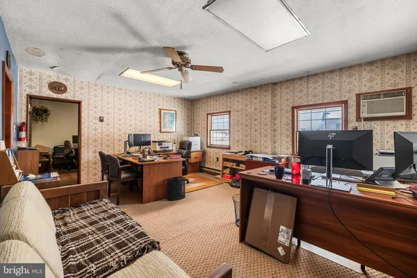 a workspace with furniture and air hockey table