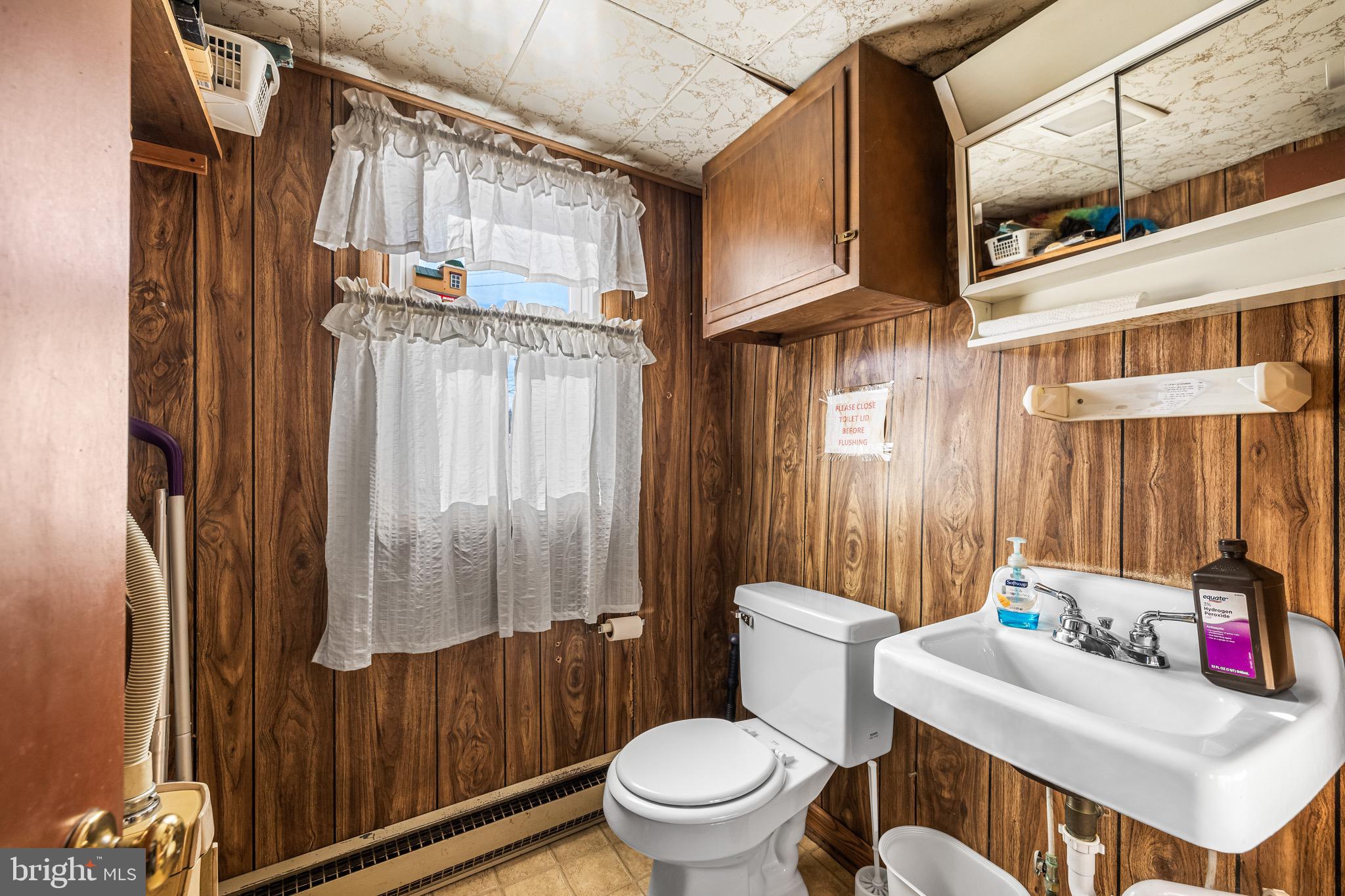 1421 North Main Street Hampstead, MD 21074 - Photo 21 of 44 a bathroom with a sink toilet and shower