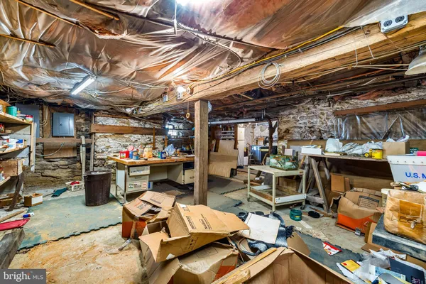 a view of a dirt road with a building in the background