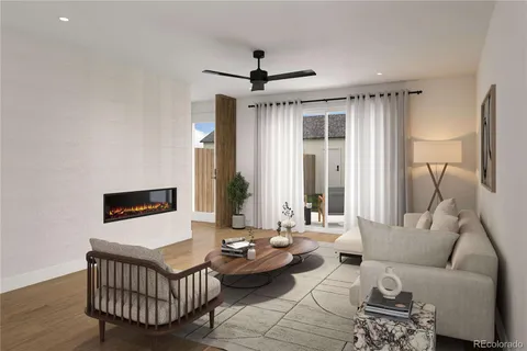 a living room with furniture wooden floor and ceiling fan
