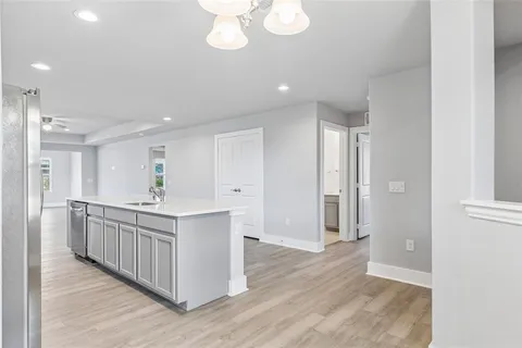 a kitchen with a sink and cabinets