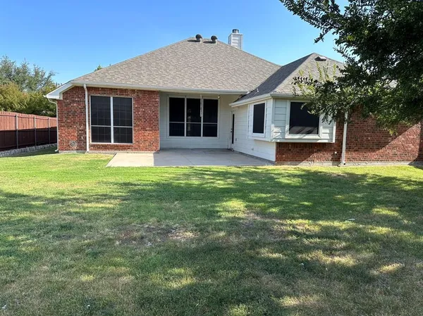 a front view of a house with a garden and porch