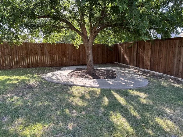 a view of outdoor space with wooden fence