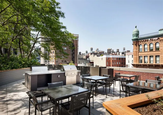 a view of a tables and chairs in the patio