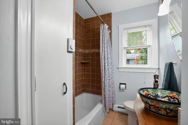 a bathroom with a toilet and a bathtub