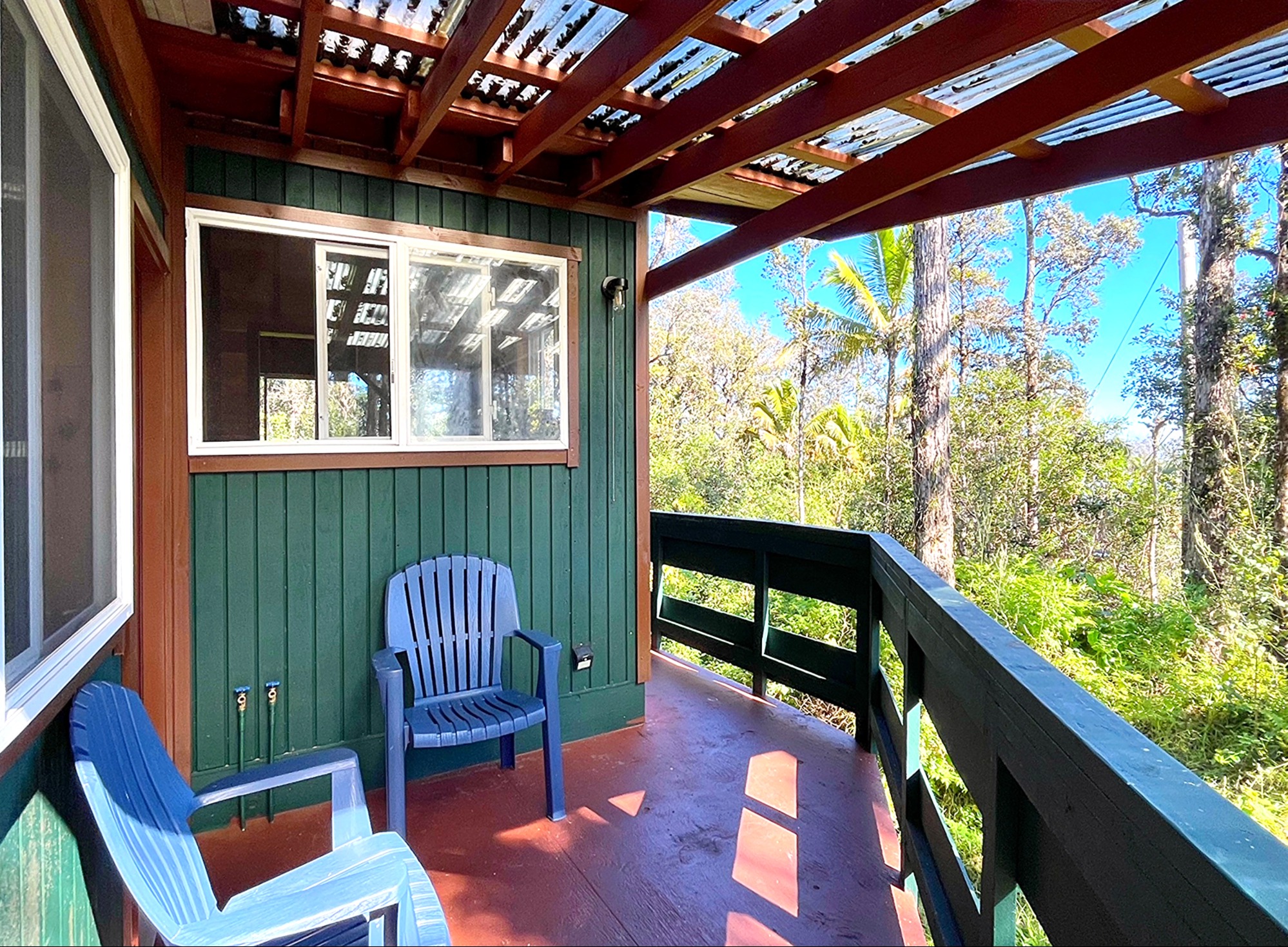 12-4275 Upper Puna Road Pahoa, HI 96778 - Photo 11 of 22 a view of a chair and table in the balcony