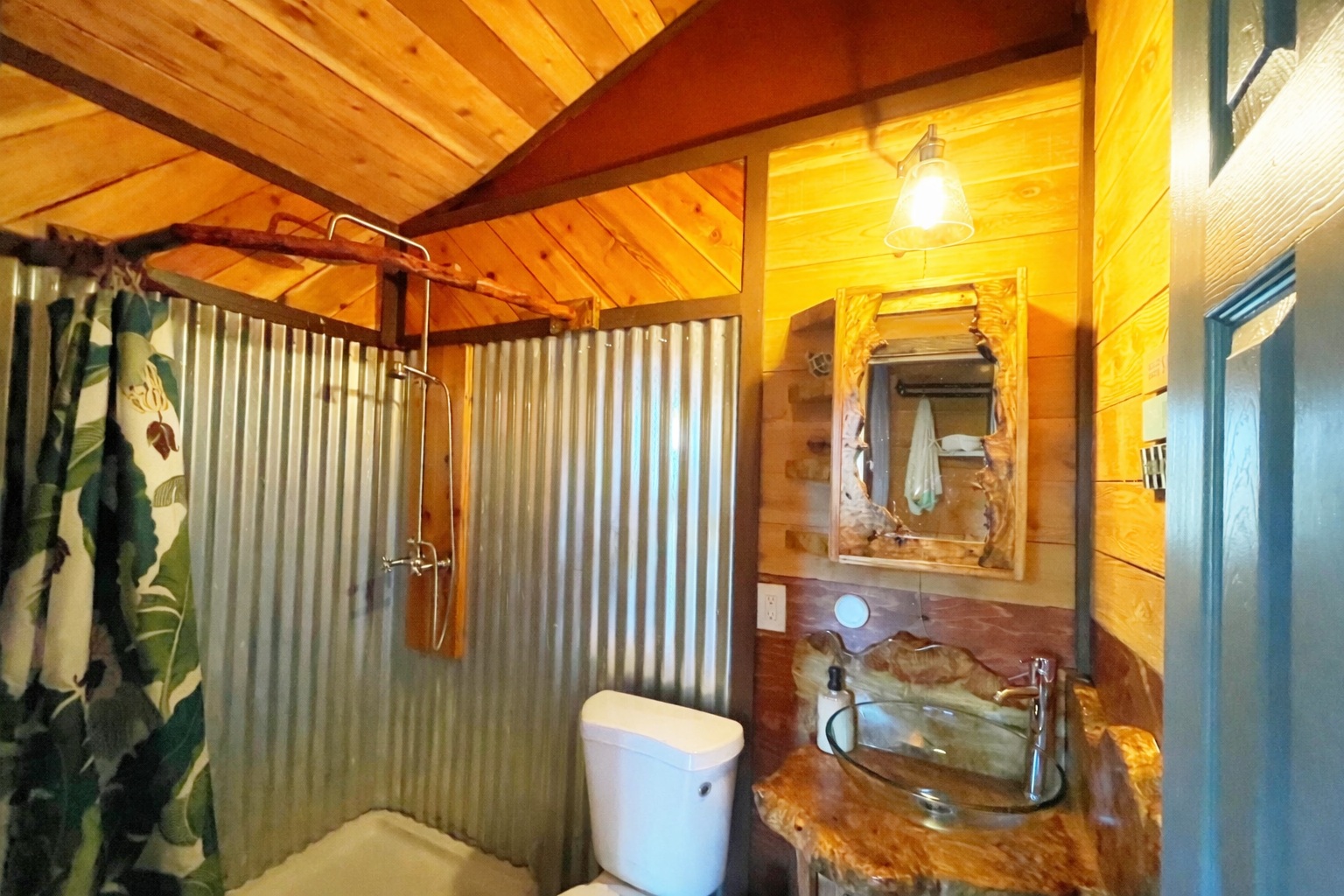 12-4275 Upper Puna Road Pahoa, HI 96778 - Photo 7 of 22 a bathroom with a toilet sink and mirror