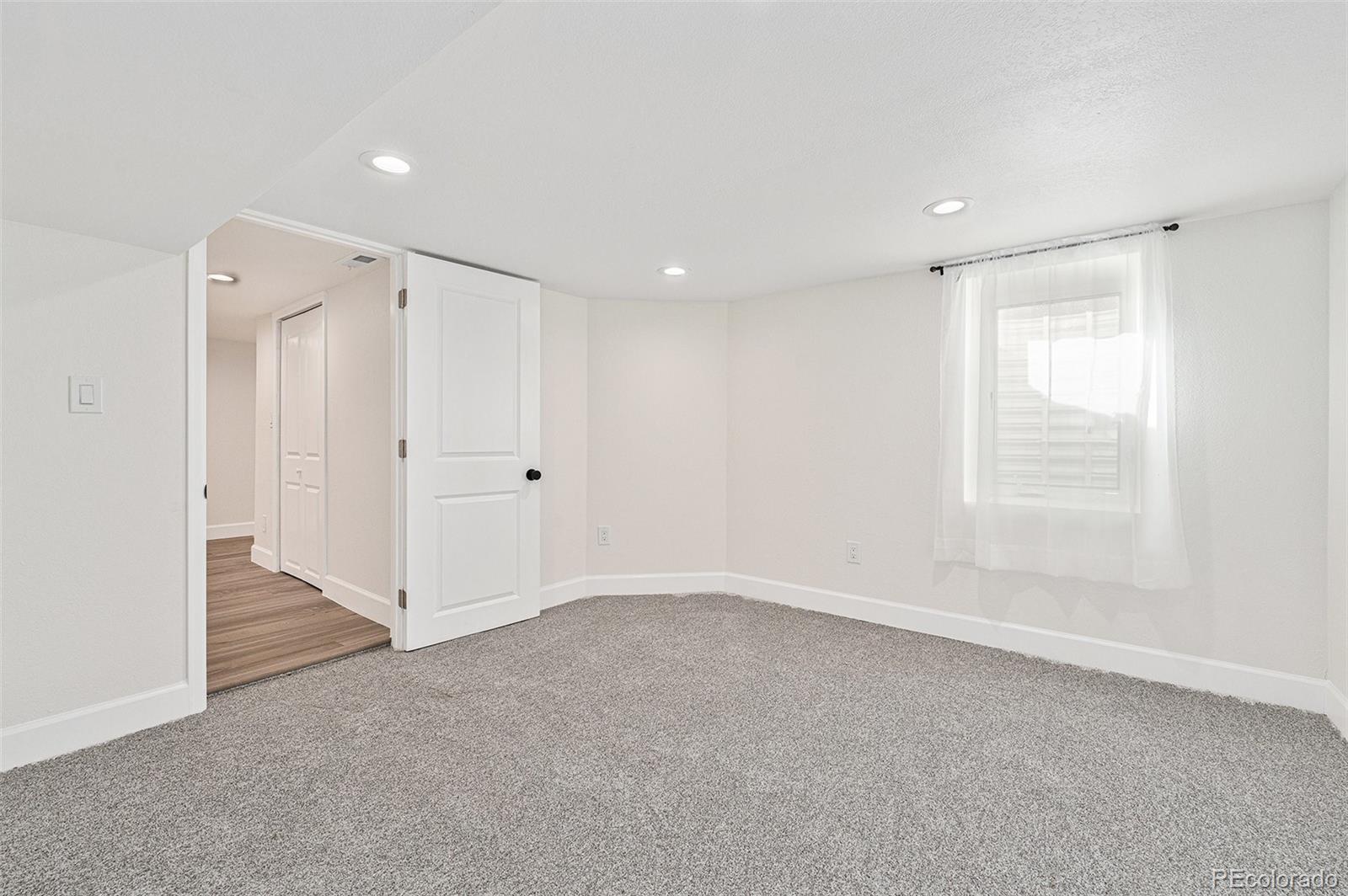 300 Inca Street Denver, CO 80223 - Photo 17 of 20 a view of an empty room with a window