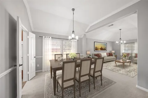 a view of kitchen with kitchen island a sink a stove and a refrigerator