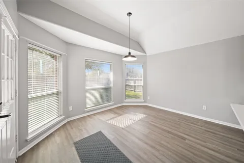a open kitchen with cabinets and stainless steel appliances