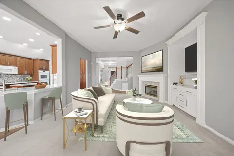 a big room with chandelier and windows