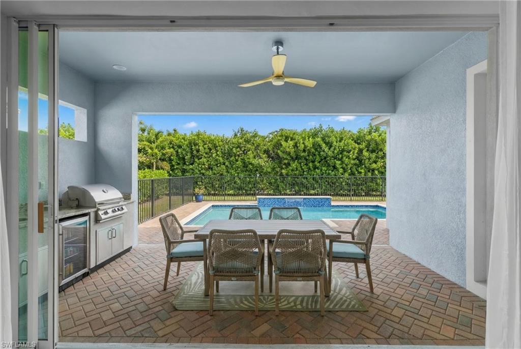 3419 Pilot Circle Naples, FL 34120 - Photo 14 of 39 a view of a dining room with furniture window and outside view