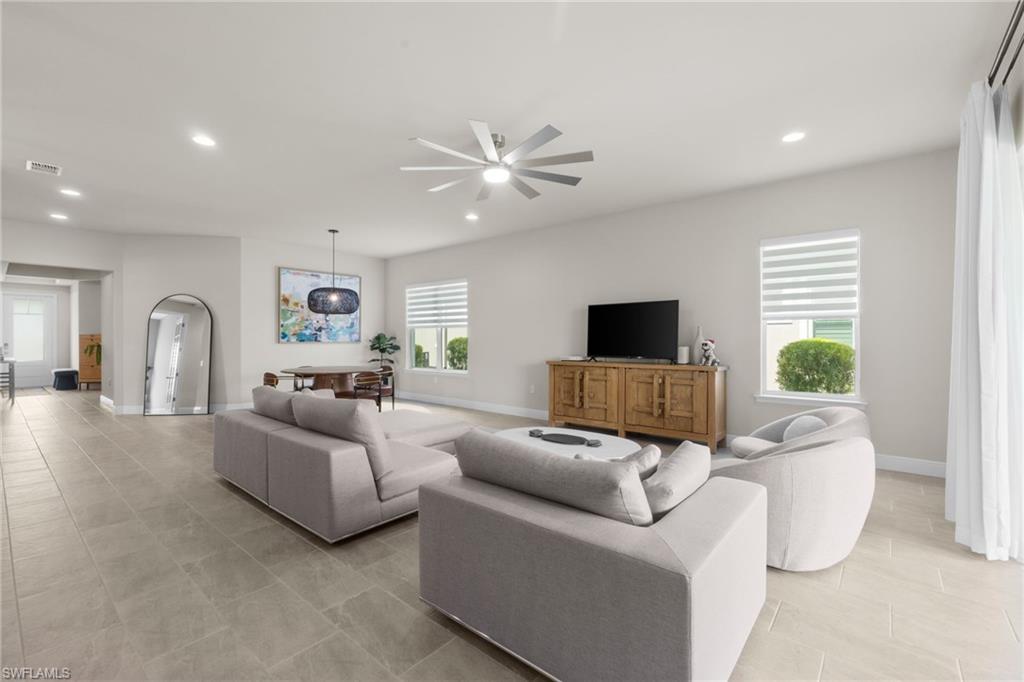 3419 Pilot Circle Naples, FL 34120 - Photo 18 of 39 a living room with furniture and a flat screen tv