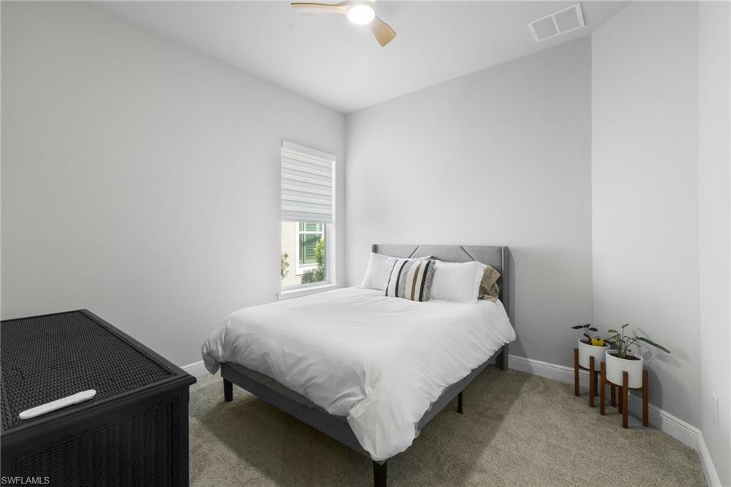 3419 Pilot Circle Naples, FL 34120 - Photo 20 of 39 a bedroom with a bed and a window