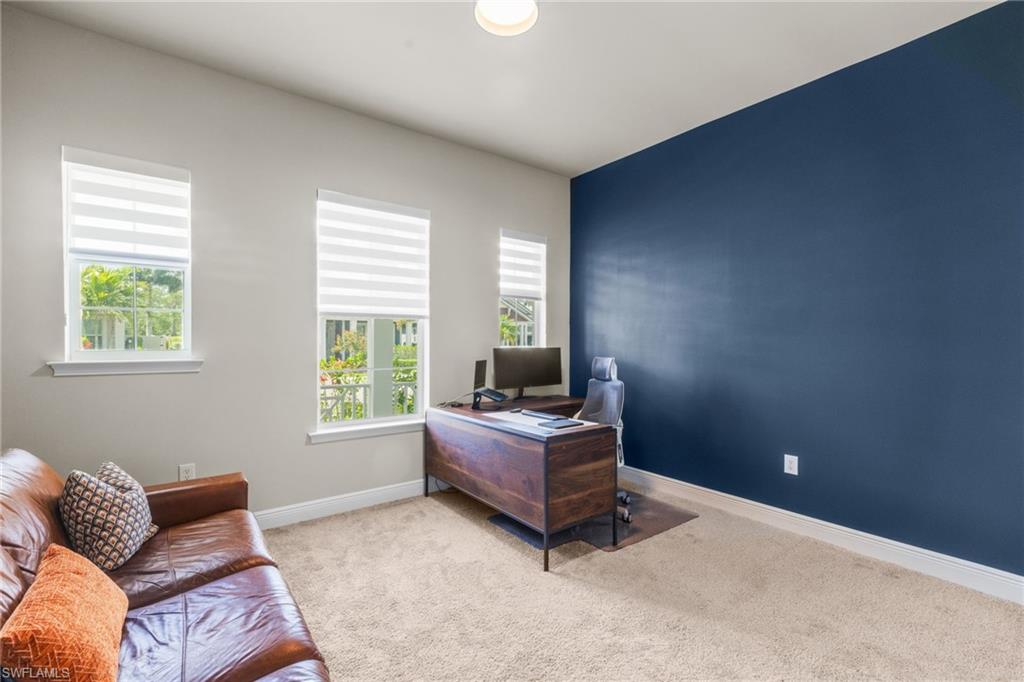 3419 Pilot Circle Naples, FL 34120 - Photo 23 of 39 a living room with furniture and a window