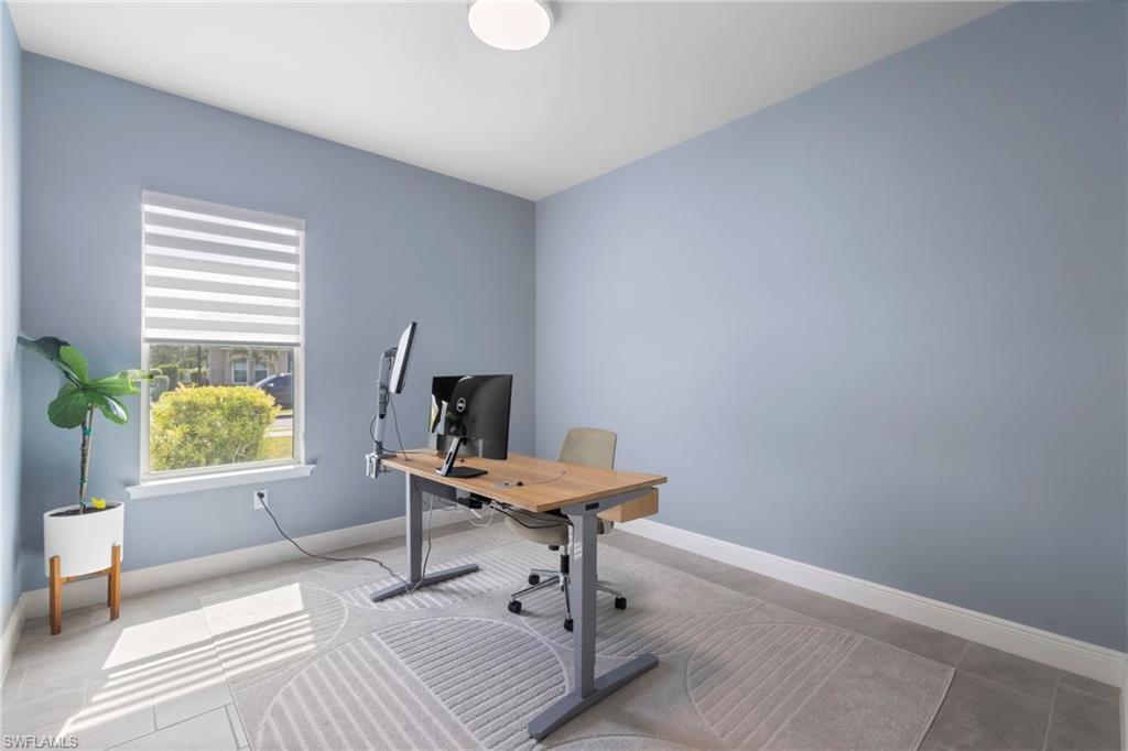 3419 Pilot Circle Naples, FL 34120 - Photo 25 of 39 a room with furniture and a window