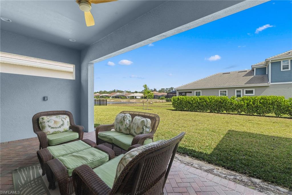 3419 Pilot Circle Naples, FL 34120 - Photo 29 of 39 a view of a swimming pool and outdoor seating