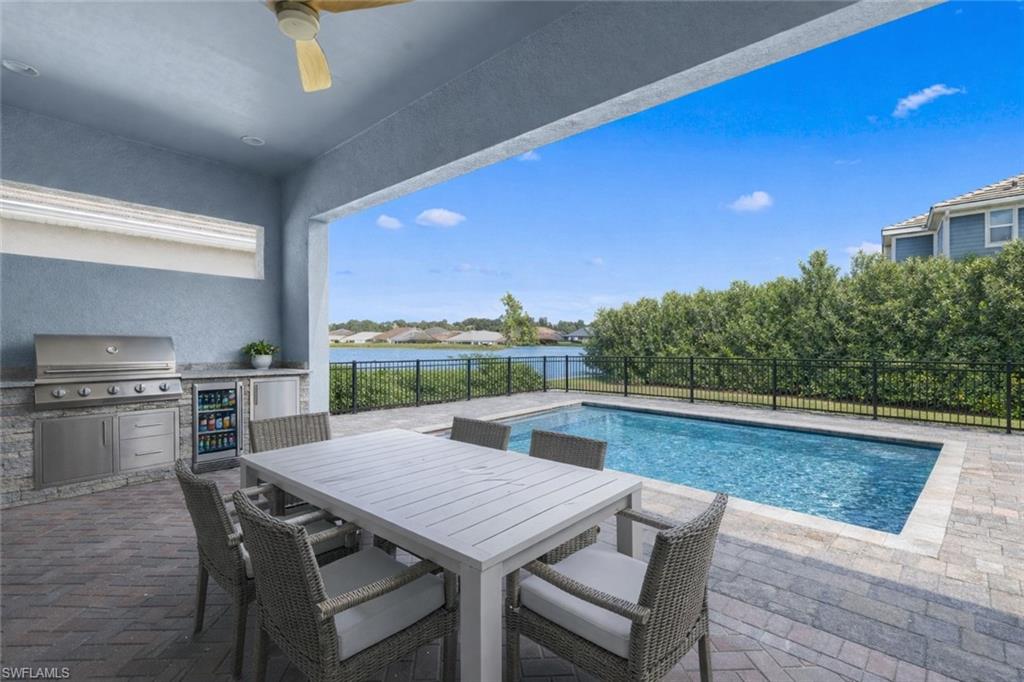 3419 Pilot Circle Naples, FL 34120 - Photo 30 of 39 a view of a dining table and chairs in the terrace