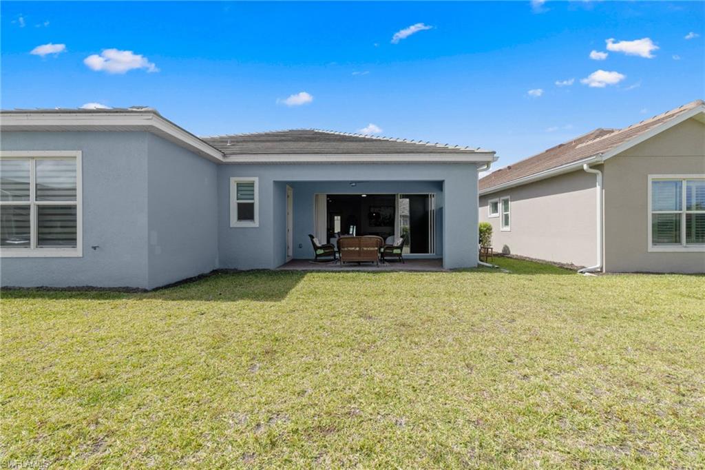 3419 Pilot Circle Naples, FL 34120 - Photo 32 of 39 a view of a house with a backyard space
