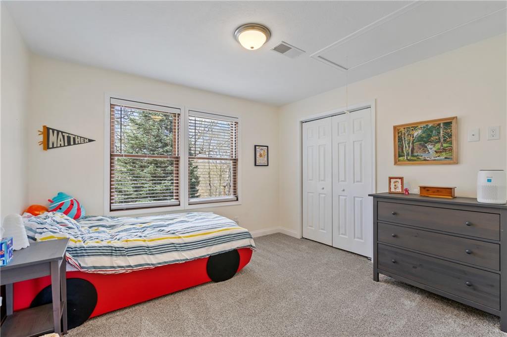 2175 Lovi Road Freedom, PA 15042 - Photo 24 of 36 a spacious bedroom with a bed and a cabinets