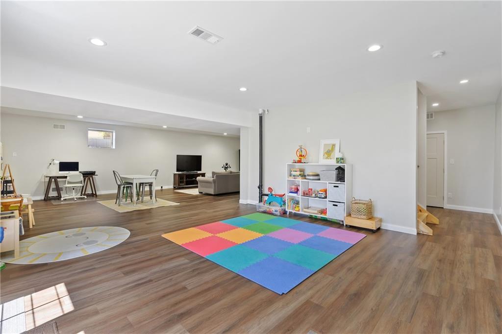 2175 Lovi Road Freedom, PA 15042 - Photo 26 of 36 a living room with kitchen view and flat screen tv