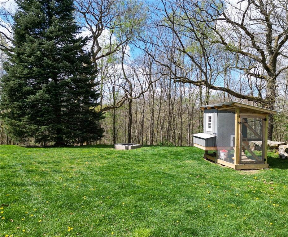 2175 Lovi Road Freedom, PA 15042 - Photo 31 of 36 a view of a backyard with large trees