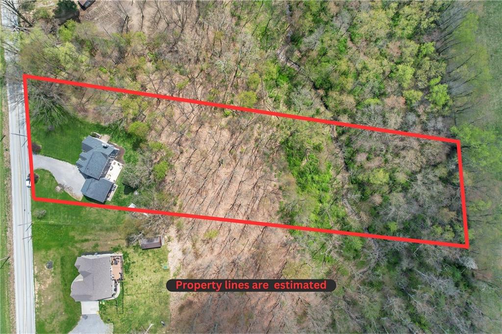 2175 Lovi Road Freedom, PA 15042 - Photo 36 of 36 a view of sign board with flower plants and wooden fence