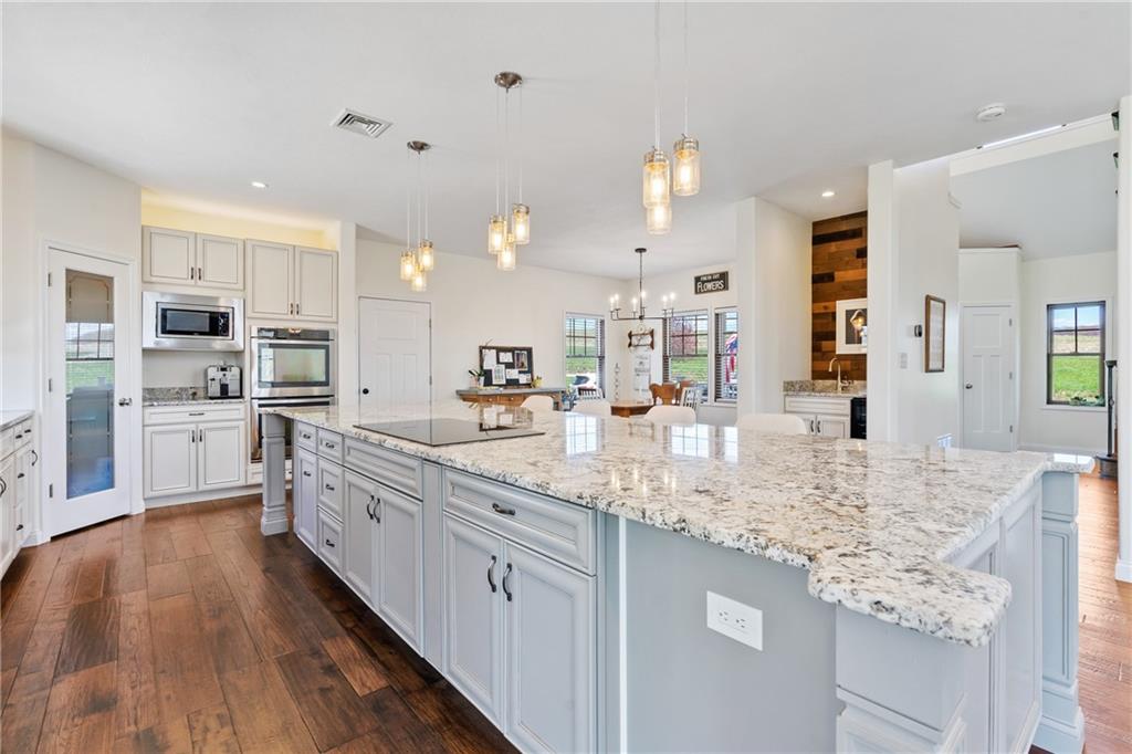 2175 Lovi Road Freedom, PA 15042 - Photo 7 of 36 a large kitchen with kitchen island a sink stainless steel appliances and cabinets