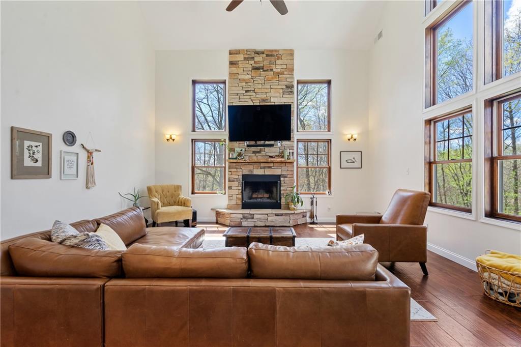2175 Lovi Road Freedom, PA 15042 - Photo 9 of 36 a living room with furniture a flat screen tv and a fireplace