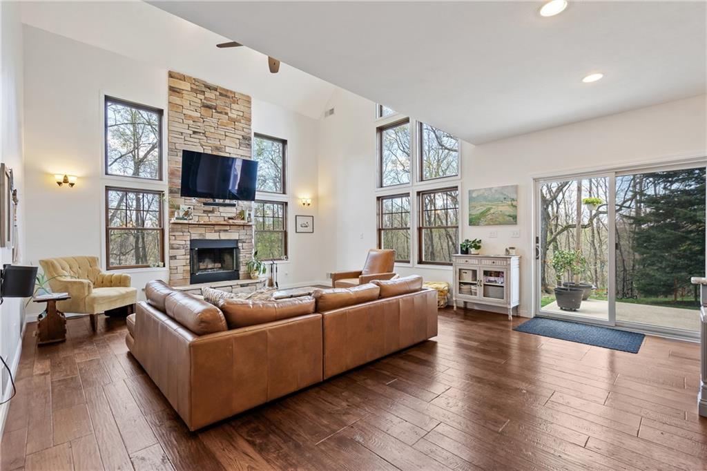 2175 Lovi Road Freedom, PA 15042 - Photo 10 of 36 a living room with furniture flat screen tv and a fireplace
