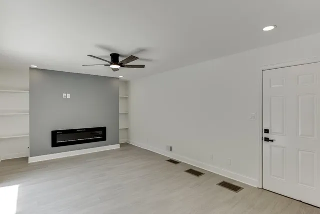 a view of an empty room with a window