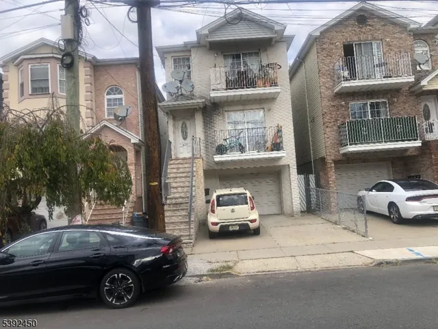 a view of a car parked in front of a building