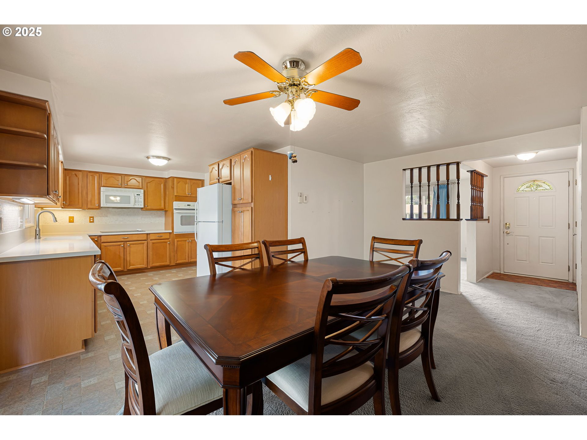 2030 Valhalla Street Eugene, OR 97401 - Photo 14 of 45 a view of a dining room with furniture and a chandelier