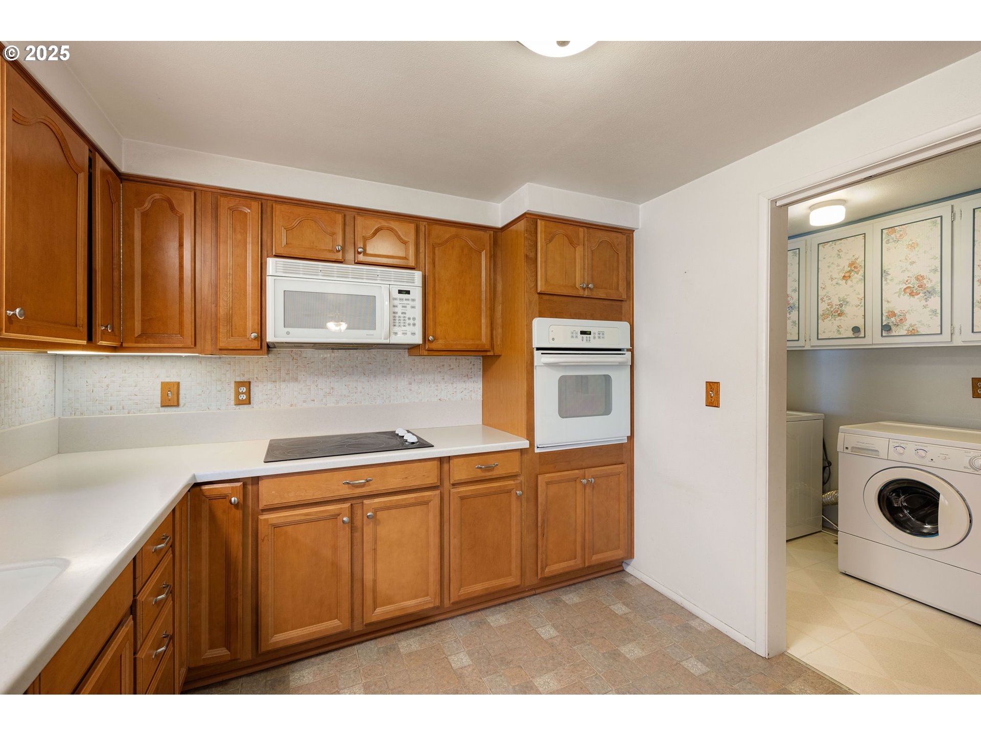 2030 Valhalla Street Eugene, OR 97401 - Photo 17 of 45 a kitchen with a sink a stove and cabinets