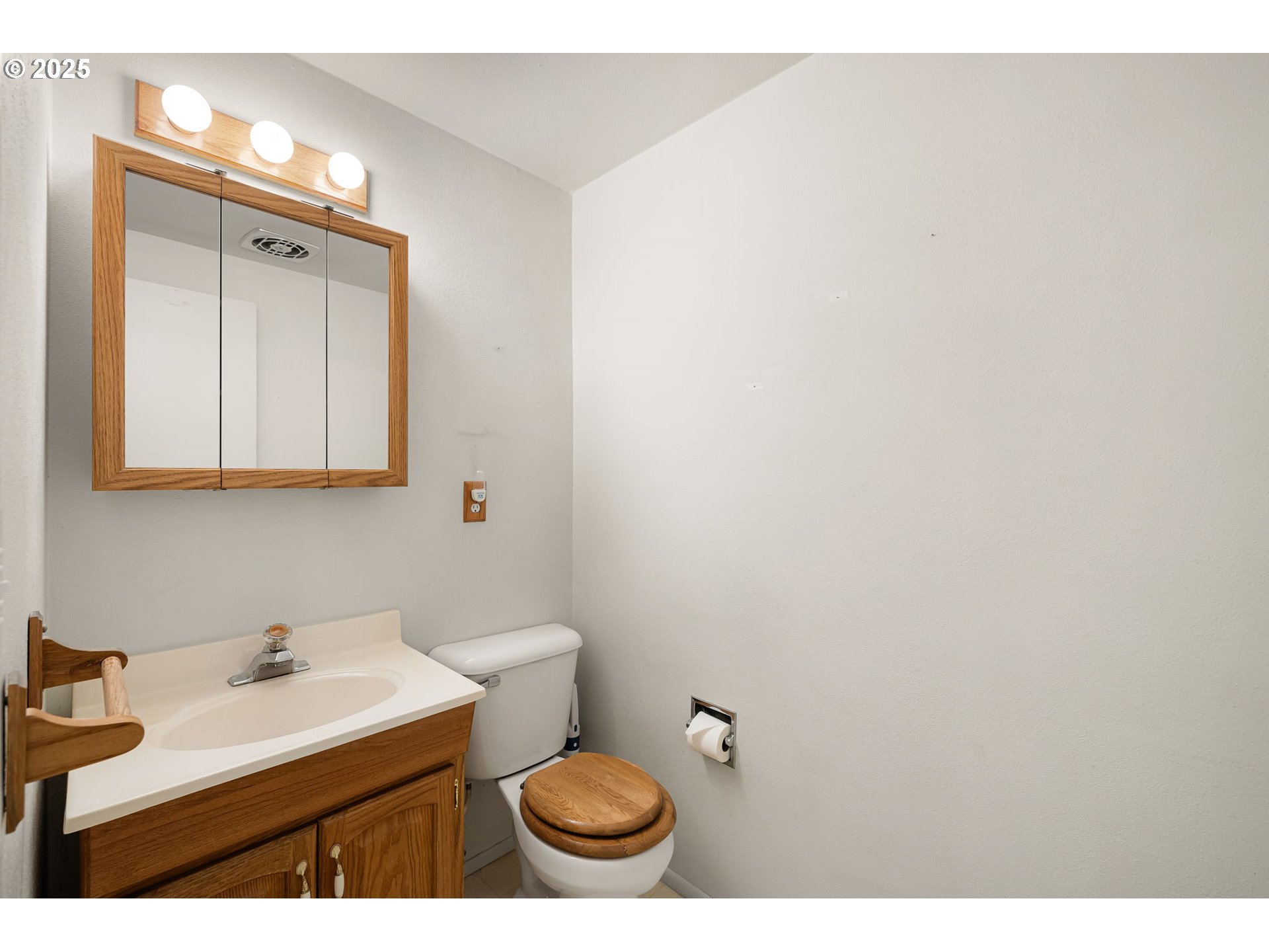 2030 Valhalla Street Eugene, OR 97401 - Photo 19 of 45 a bathroom with a sink a toilet and a mirror