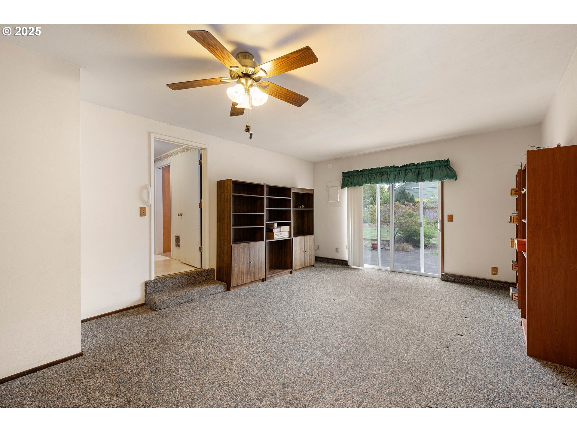 2030 Valhalla Street Eugene, OR 97401 - Photo 22 of 45 a view of a livingroom with a ceiling fan and window