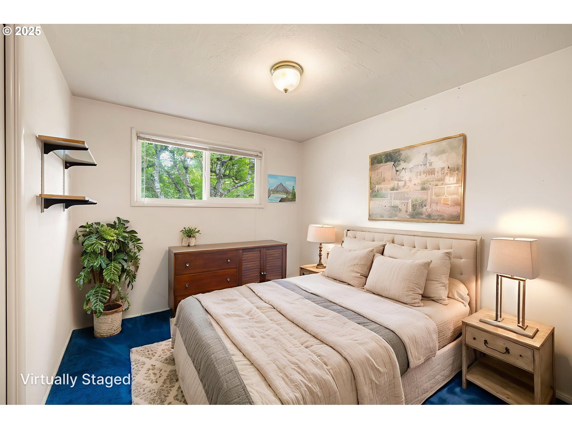 2030 Valhalla Street Eugene, OR 97401 - Photo 27 of 45 a bedroom with a bed and a potted plant