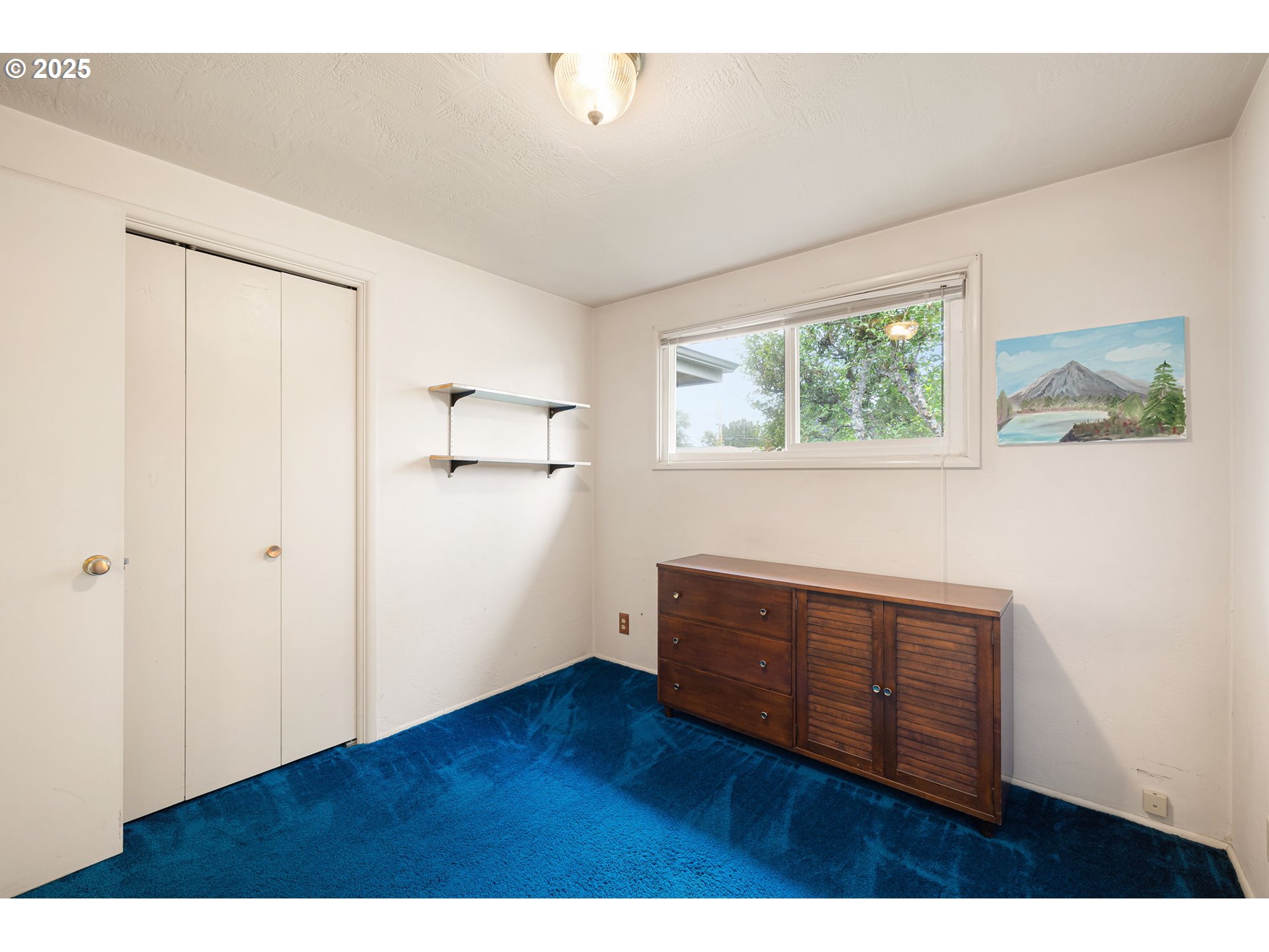 2030 Valhalla Street Eugene, OR 97401 - Photo 28 of 45 a view of empty room with wooden floor and fan