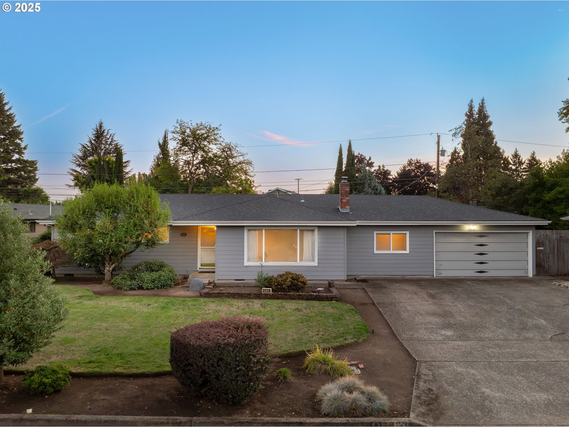 2030 Valhalla Street Eugene, OR 97401 - Photo 3 of 45 a front view of a house with garden