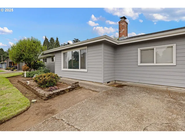 a view of a livingroom with furniture and staircase