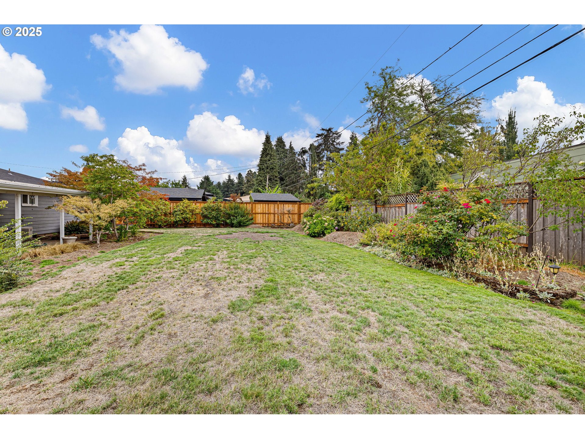 2030 Valhalla Street Eugene, OR 97401 - Photo 43 of 45 a view of a big yard with table and chairs and a large tree