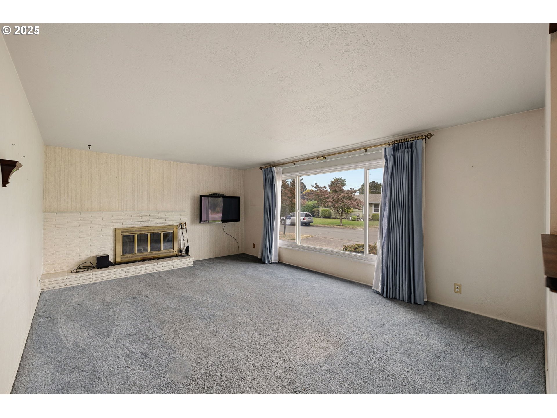 2030 Valhalla Street Eugene, OR 97401 - Photo 7 of 45 a view of a big room with windows and an empty room