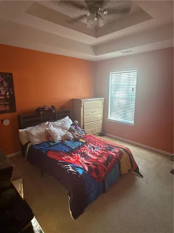 a bedroom with a bed and window