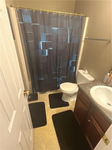 a bathroom with a sink and toilet